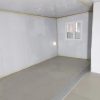 Prefabricated three-in-one foldable and expandable double-wing container house