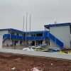 Blue four-slope roof T-shaped prefabricated house