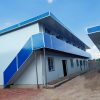 Blue four-slope roof T-shaped prefabricated house