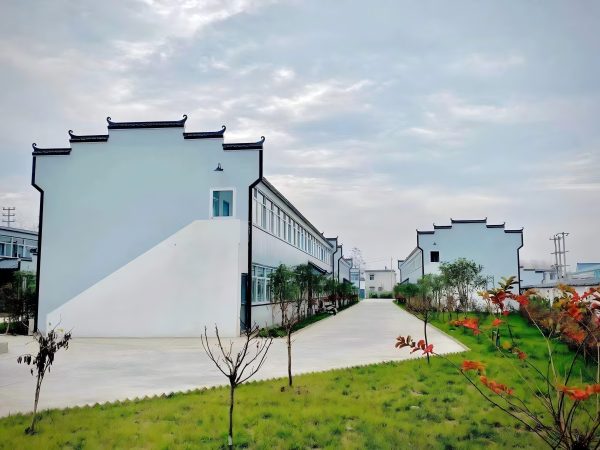 Dark gray quadrangle-style traditional T-shaped prefabricated house