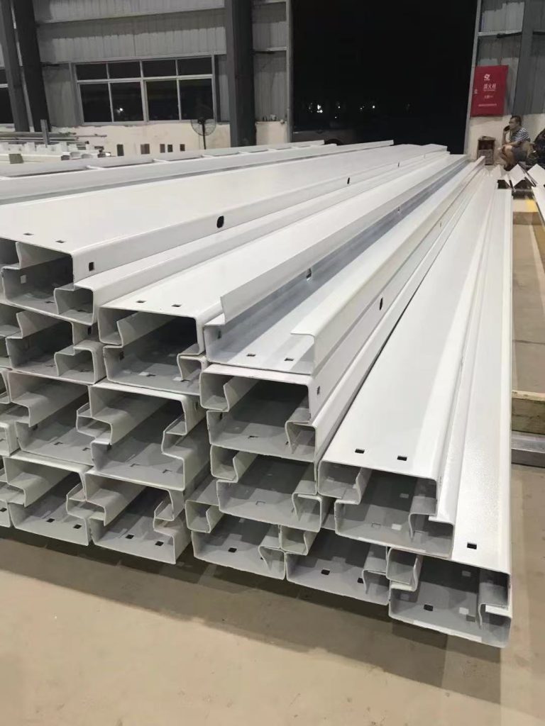 The factory workshop produces house components.
