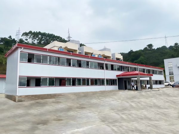 Red four-slope roof T-shaped prefabricated house