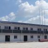 Dark gray quadrangle-style traditional T-shaped prefabricated house