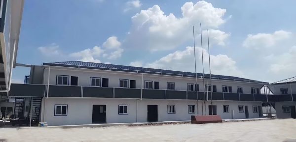 Dark gray quadrangle-style traditional T-shaped prefabricated house