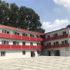 Red four-slope roof T-shaped prefabricated house