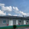 Dark gray quadrangle-style traditional T-shaped prefabricated house