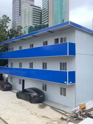 Blue four-slope roof T-shaped prefabricated house