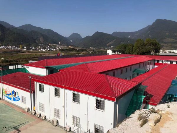 Red four-slope roof T-shaped prefabricated house