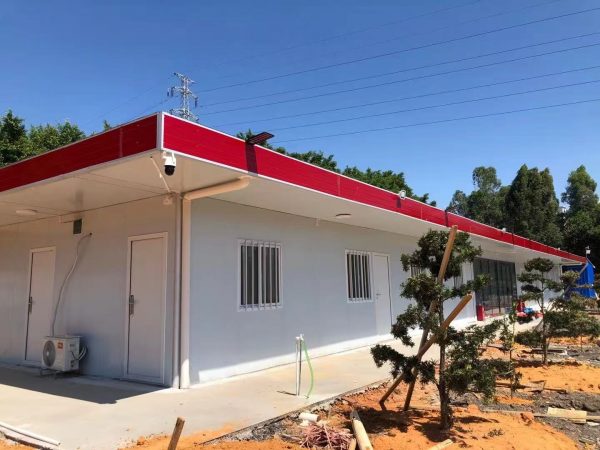 Red four-slope roof T-shaped prefabricated house