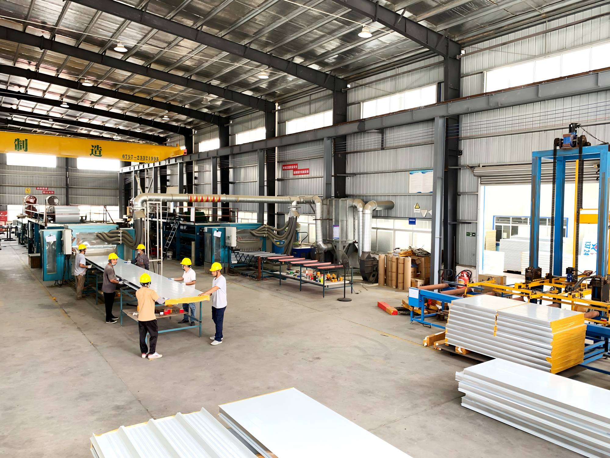 Two steel sandwich panel machines