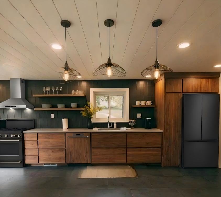 Modern kitchen inside stacked container home with full appliances
