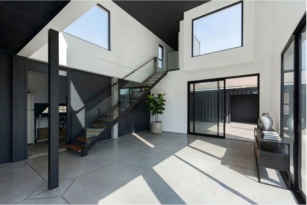 Double-story modular container house with open-plan living room