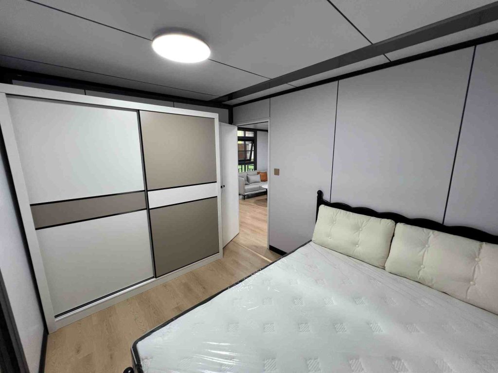 Modern bedroom design inside modular expandable container home