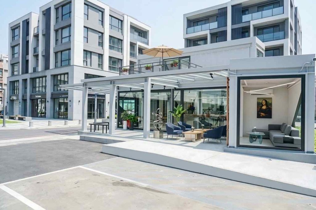 Minimalist steel structure container café interior with floor-to-ceiling windows