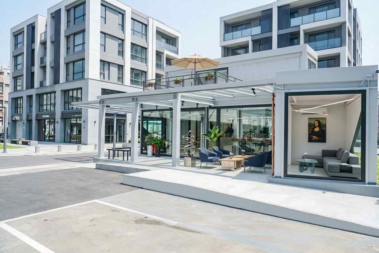 Minimalist steel structure container café interior with floor-to-ceiling windows