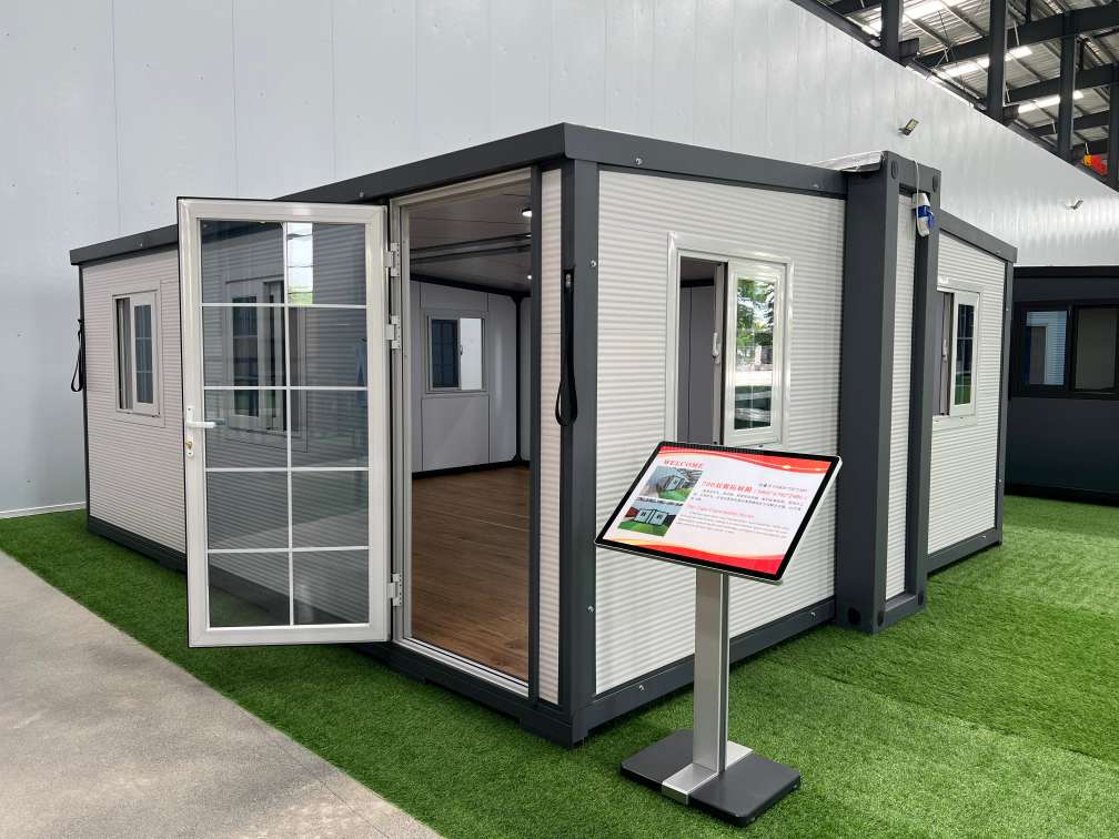 Spacious interior of a double wing expandable container house with modular residential layout